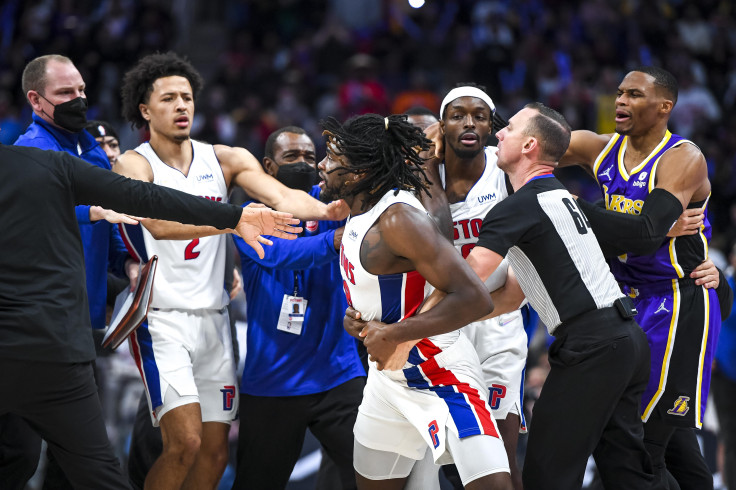 Isaiah Stewart #28 of the Detroit Pistons is restrained as he goes after LeBron James #6 of the Los Angeles Lakers