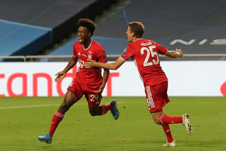 Kingsley Coman celebrates with Thomas Mueller after scoring the goal that won the Champions League final for Bayern Munich against Paris Saint-Germain on Sunday