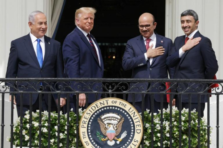 Former Israeli PM Benjamin Netanyahu, US president Donald Trump, Bahrain FM Abdullatif bin Rashid Al Zayani and UAE FM Abdullah bin Zayed bin Sultan Al Nahyan at the signing of the Abraham Accords at the White House on September 15, 2020