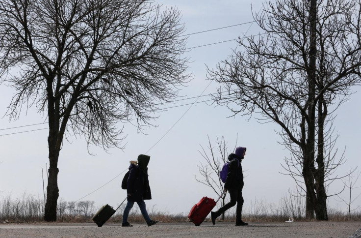 Refugees leave the besieged city of Mariupol