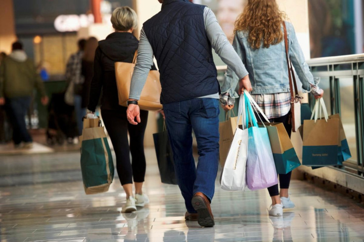 Shoppers carry bags of purchased merchandise at the King of Prussia Mall, United States' largest retail shopping space, in King of Prussia