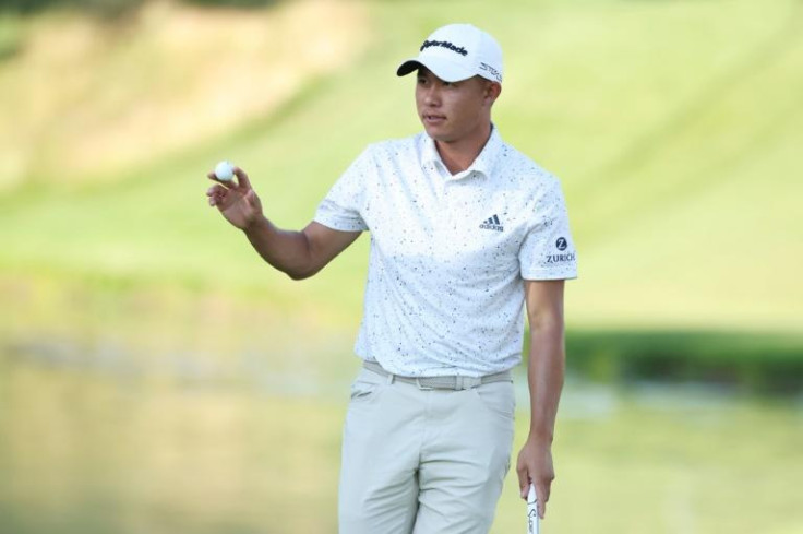 Two-time major winner Collin Morikawa of the United States fired a four-under par 66 to seize the lead late in Friday's second round of the US Open