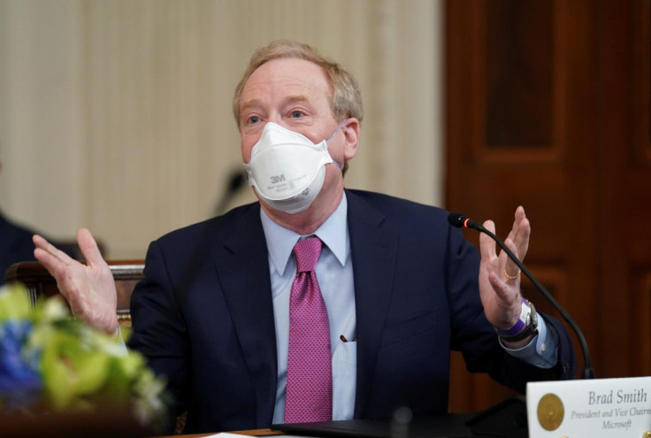Microsoft President Smith speak at a White House meeting with private sector CEOs in Washington