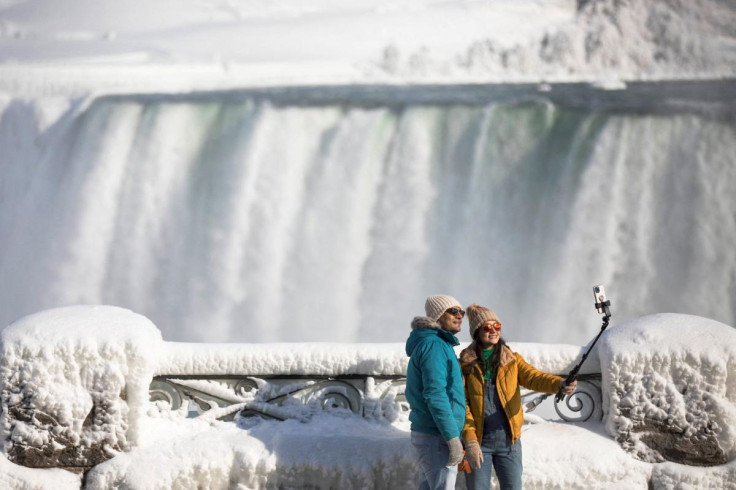 Tourists take a selfie overlooking Niagara Falls