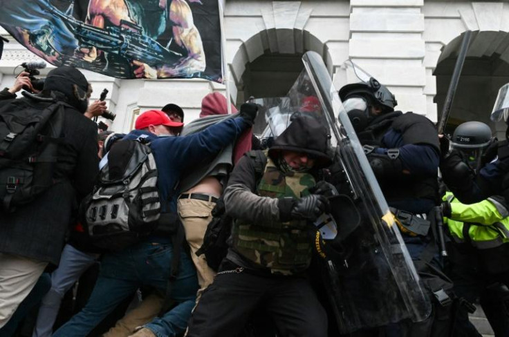 Riot police push back a crowd of supporters of US President Donald Trump after they stormed the Capitol building on January 6, 2021