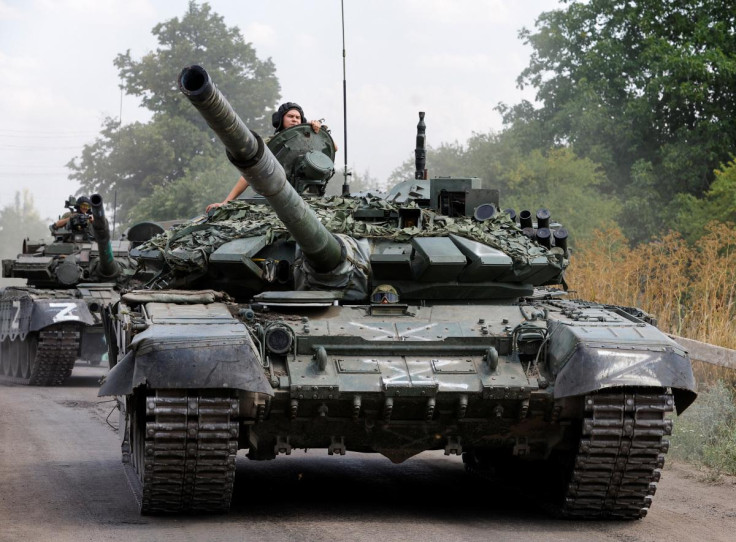 Service members of pro-Russian troops drive tanks in the course of Ukraine-Russia conflict near the settlement of Olenivka